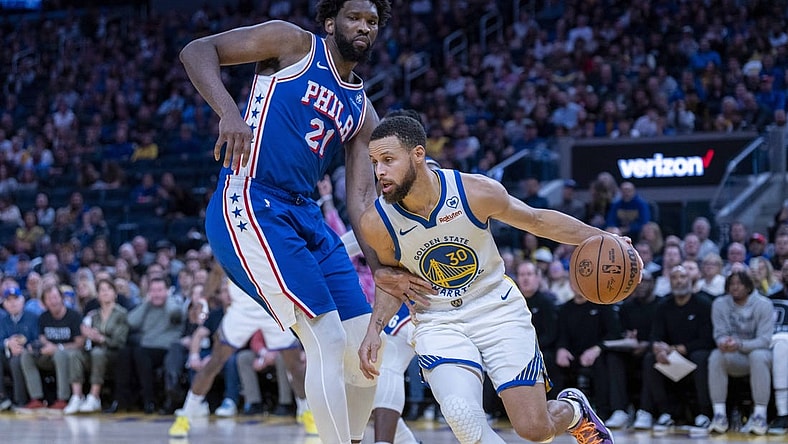 Jan 30, 2024; San Francisco, California, USA;  Golden State Warriors guard Stephen Curry (30) drives against Philadelphia 76ers center Joel Embiid (21) during the fourth quarter at Chase Center. Mandatory Credit: Neville E. Guard-USA TODAY Sports