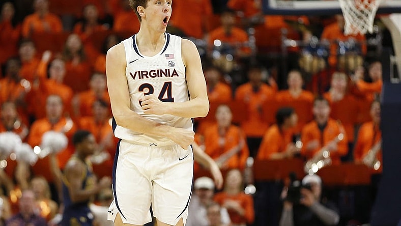Jan 31, 2024; Charlottesville, Virginia, USA; Virginia Cavaliers forward Jacob Groves (34) celebrates after scoring against the Notre Dame Fighting Irish during the first half at John Paul Jones Arena. Mandatory Credit: Amber Searls-USA TODAY Sports