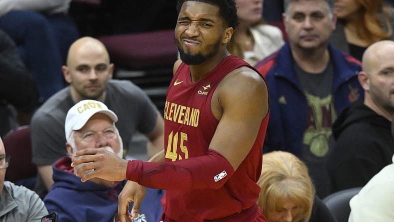 Jan 31, 2024; Cleveland, Ohio, USA; Cleveland Cavaliers guard Donovan Mitchell (45) reacts after he was hit in the face in the fourth quarter against the Detroit Pistons at Rocket Mortgage FieldHouse. Mandatory Credit: David Richard-USA TODAY Sports