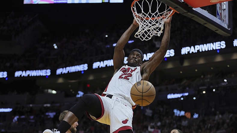 Jan 31, 2024; Miami, Florida, USA; Miami Heat forward Jimmy Butler (22) dunks the basketball against the Sacramento Kings during the third quarter at Kaseya Center. Mandatory Credit: Sam Navarro-USA TODAY Sports