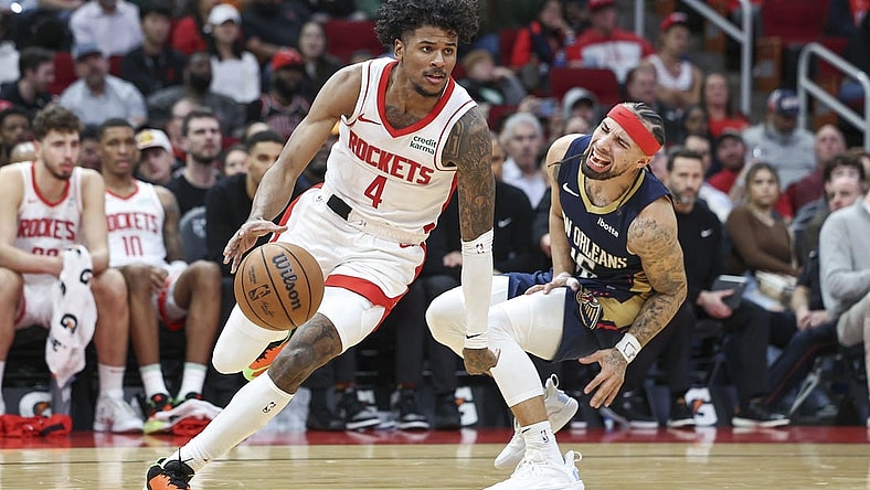Jan 31, 2024; Houston, Texas, USA; New Orleans Pelicans guard Jose Alvarado (15) reacts as Houston Rockets guard Jalen Green (4) drives with the ball during the fourth quarter at Toyota Center. Mandatory Credit: Troy Taormina-USA TODAY Sports