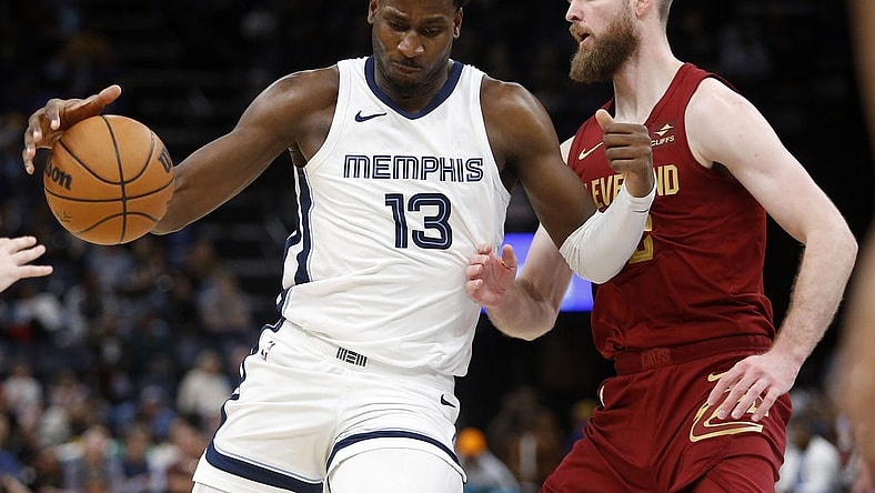 Feb 1, 2024; Memphis, Tennessee, USA; Memphis Grizzlies forward-center Jaren Jackson Jr. (13) drives to the basket as Cleveland Cavaliers forward Dean Wade (32) defends during the second half at FedExForum. Mandatory Credit: Petre Thomas-USA TODAY Sports