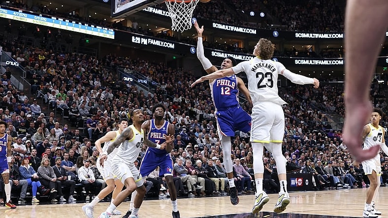 Feb 1, 2024; Salt Lake City, Utah, USA; Philadelphia 76ers forward Tobias Harris (12) lays the ball up against Utah Jazz forward Lauri Markkanen (23) during the first quarter at Delta Center. Mandatory Credit: Rob Gray-USA TODAY Sports