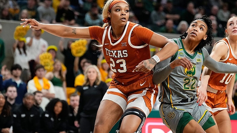 Feb 1, 2024; Waco, Texas, USA; Texas Longhorns forward Aaliyah Moore (23) and Baylor Lady Bears guard Bella Fontleroy (22) battle for position during the second half at Paul and Alejandra Foster Pavilion. Mandatory Credit: Chris Jones-USA TODAY Sports