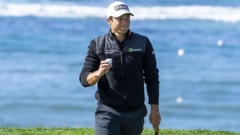 February 2, 2024; Pebble Beach, California, USA; Viktor Hovland acknowledges the crowd after making his putt on the fifth hole during the second round of the AT&T Pebble Beach Pro-Am golf tournament at Pebble Beach Golf Links. Mandatory Credit: Kyle Terada-USA TODAY Sports