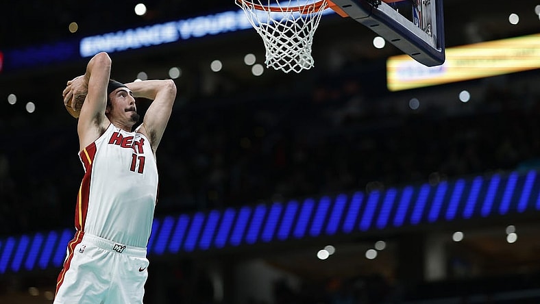 Feb 2, 2024; Washington, District of Columbia, USA; Miami Heat guard Jaime Jaquez Jr. (11) dunks the ball against the Washington Wizards in the first half at Capital One Arena. Mandatory Credit: Geoff Burke-USA TODAY Sports