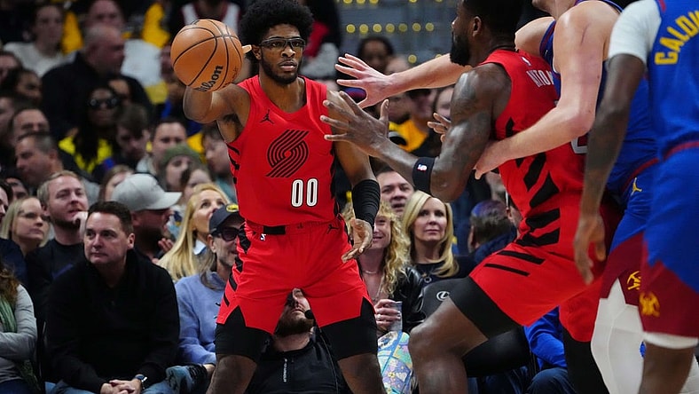 Feb 2, 2024; Denver, Colorado, USA; Portland Trail Blazers guard Scoot Henderson (00) passes the ball in the first half against the Denver Nuggets at Ball Arena. Mandatory Credit: Ron Chenoy-USA TODAY Sports