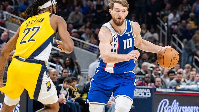 Feb 2, 2024; Indianapolis, Indiana, USA; Sacramento Kings forward Domantas Sabonis (10) dribbles the ball while Indiana Pacers forward Isaiah Jackson (22) defends in the second half at Gainbridge Fieldhouse. Mandatory Credit: Trevor Ruszkowski-USA TODAY Sports