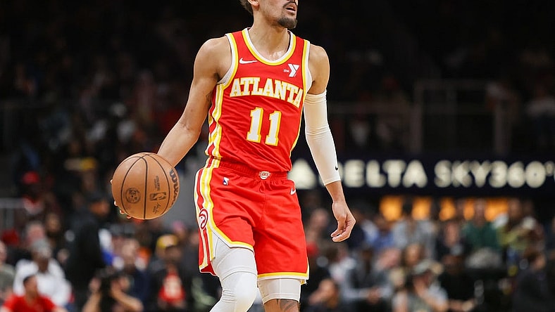 Feb 2, 2024; Atlanta, Georgia, USA; Atlanta Hawks guard Trae Young (11) dribbles against the Phoenix Suns in the second half at State Farm Arena. Mandatory Credit: Brett Davis-USA TODAY Sports