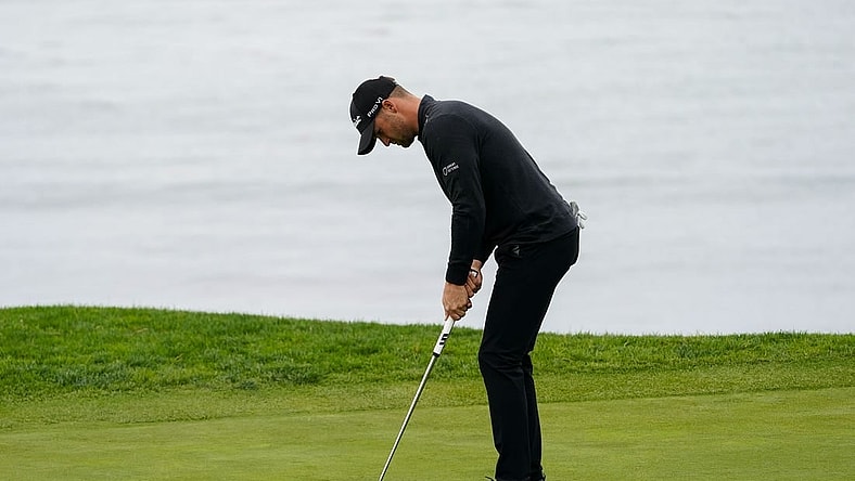 Feb 3, 2024; Pebble Beach, California, USA; Wyndham Clark putts on the fifth hole during the third round of the AT&T Pebble Beach Pro-Am golf tournament at Pebble Beach Golf Links. Mandatory Credit: Michael Madrid-USA TODAY Sports