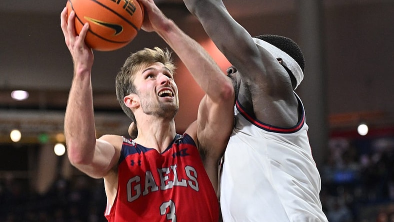 Feb 3, 2024; Spokane, Washington, USA; St. Mary's Gaels guard Augustas Marciulionis (3) shoots the ball against Gonzaga Bulldogs forward Graham Ike (13) in the second half at McCarthey Athletic Center. St. Mary's Gaels won 64-62. Mandatory Credit: James Snook-USA TODAY Sports