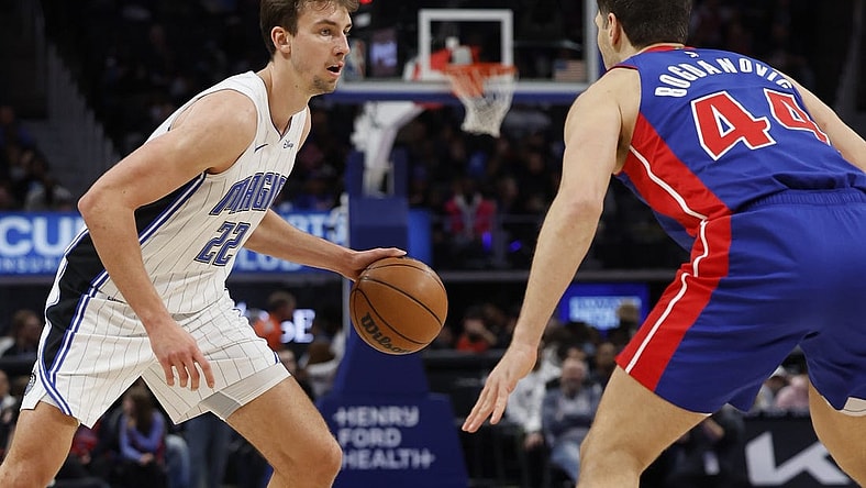 Feb 4, 2024; Detroit, Michigan, USA; Orlando Magic forward Franz Wagner (22) is defended by Detroit Pistons forward Bojan Bogdanovic (44) in the first half at Little Caesars Arena. Mandatory Credit: Rick Osentoski-USA TODAY Sports
