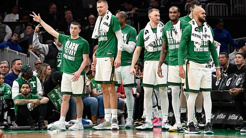 Feb 4, 2024; Boston, Massachusetts, USA; the Celtics bench reacts after a score against the Memphis Grizzlies during the second half at TD Garden. Mandatory Credit: Eric Canha-USA TODAY Sports