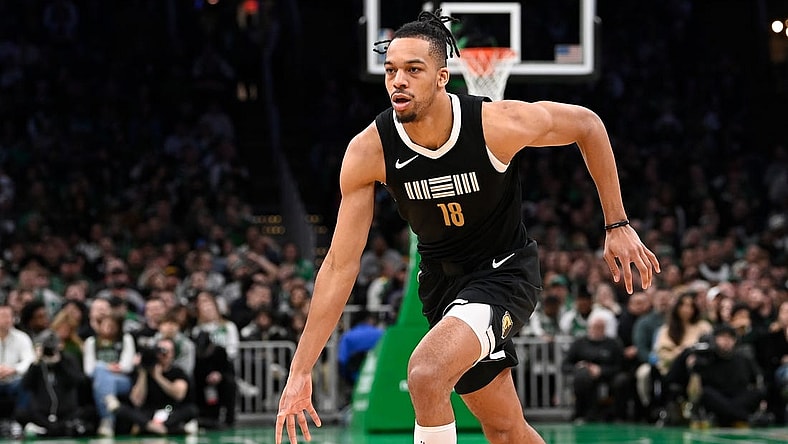 Feb 4, 2024; Boston, Massachusetts, USA; Memphis Grizzlies forward Tosan Evbuomwan (18) dribbles the ball against the Boston Celtics during the second half at TD Garden. Mandatory Credit: Eric Canha-USA TODAY Sports