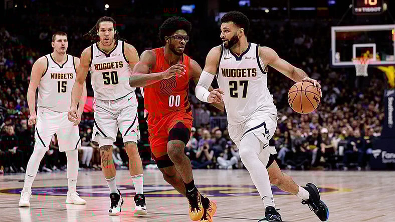 Feb 4, 2024; Denver, Colorado, USA; Denver Nuggets guard Jamal Murray (27) controls the ball against Portland Trail Blazers guard Scoot Henderson (00) as forward Aaron Gordon (50) and center Nikola Jokic (15) defend in the second quarter at Ball Arena. Mandatory Credit: Isaiah J. Downing-USA TODAY Sports