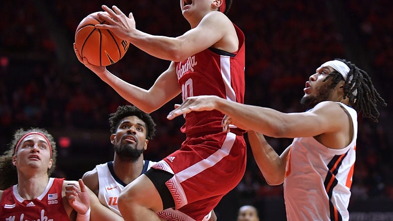 Feb 4, 2024; Champaign, Illinois, USA;  Nebraska Cornhuskers guard Keisei Tominaga (30) drives past Illinois Fighting Illini forward Ty Rodgers (20) during the second half at State Farm Center. Mandatory Credit: Ron Johnson-USA TODAY Sports