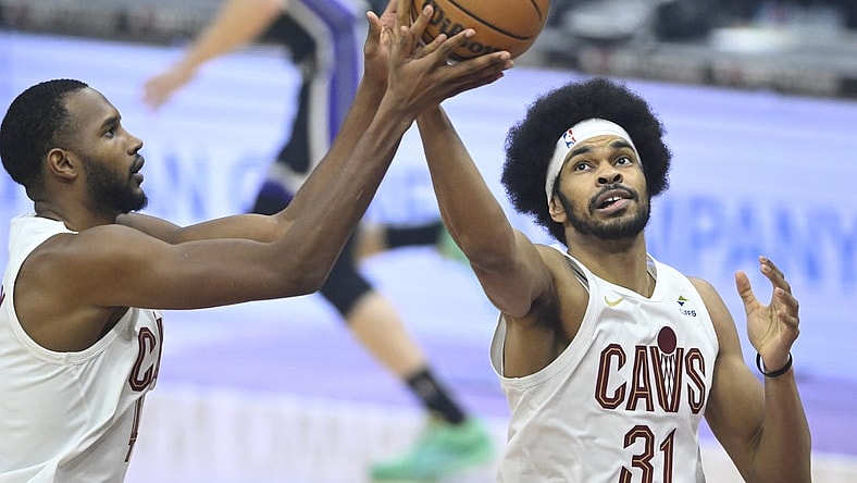 Feb 5, 2024; Cleveland, Ohio, USA; Cleveland Cavaliers center Jarrett Allen (31) rebounds beside forward Evan Mobley (4) in the first quarter against the Sacramento Kings at Rocket Mortgage FieldHouse. Mandatory Credit: David Richard-USA TODAY Sports