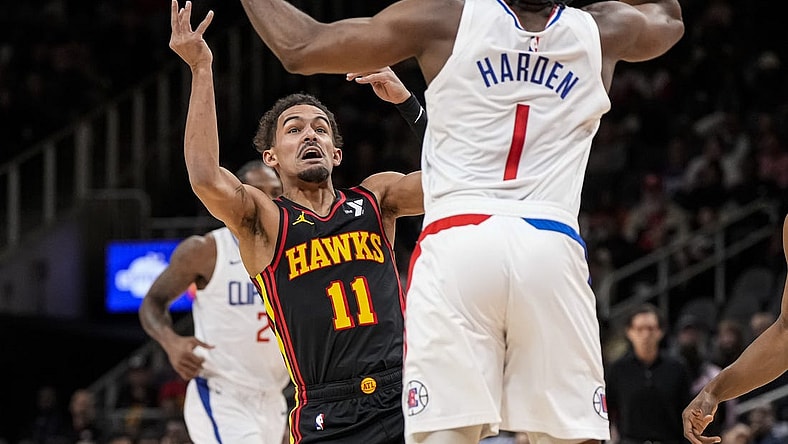 Feb 5, 2024; Atlanta, Georgia, USA; Atlanta Hawks guard Trae Young (11) looses the ball against LA Clippers guard James Harden (1) during the first half at State Farm Arena. Mandatory Credit: Dale Zanine-USA TODAY Sports