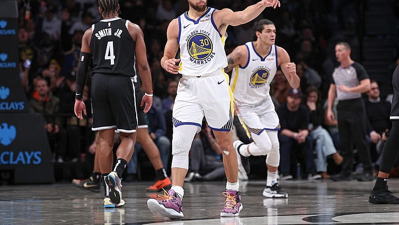 Feb 5, 2024; Brooklyn, New York, USA; Golden State Warriors guard Stephen Curry (30) reacts after making a three point basket during the first half against the Brooklyn Nets at Barclays Center. Mandatory Credit: Vincent Carchietta-USA TODAY Sports