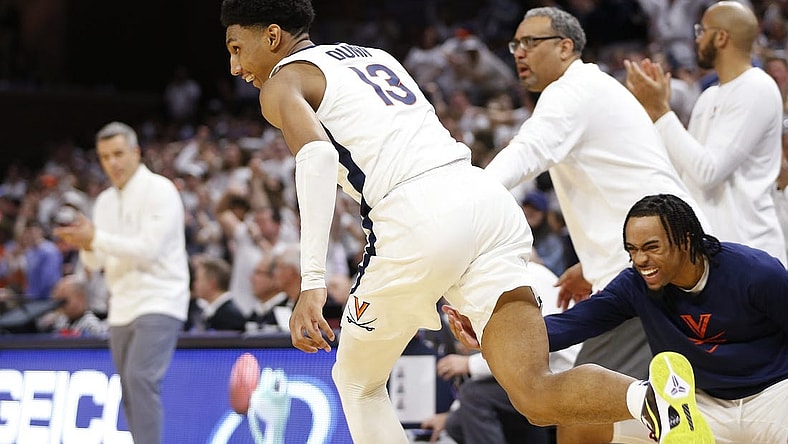 Feb 5, 2024; Charlottesville, Virginia, USA; Virginia Cavaliers guard Ryan Dunn (13) celebrates after dunking the ball against the Miami (Fl) Hurricanes during the second half at John Paul Jones Arena. Mandatory Credit: Amber Searls-USA TODAY Sports