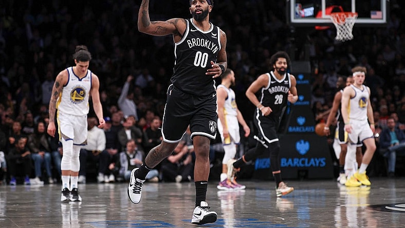 Feb 5, 2024; Brooklyn, New York, USA; Brooklyn Nets forward Royce O'Neale (00) reacts after making a three point basket during the second half against the Golden State Warriors at Barclays Center. Mandatory Credit: Vincent Carchietta-USA TODAY Sports