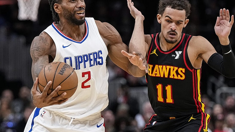 Feb 5, 2024; Atlanta, Georgia, USA; LA Clippers forward Kawhi Leonard (2) fights past Atlanta Hawks guard Trae Young (11) during the second half at State Farm Arena. Mandatory Credit: Dale Zanine-USA TODAY Sports