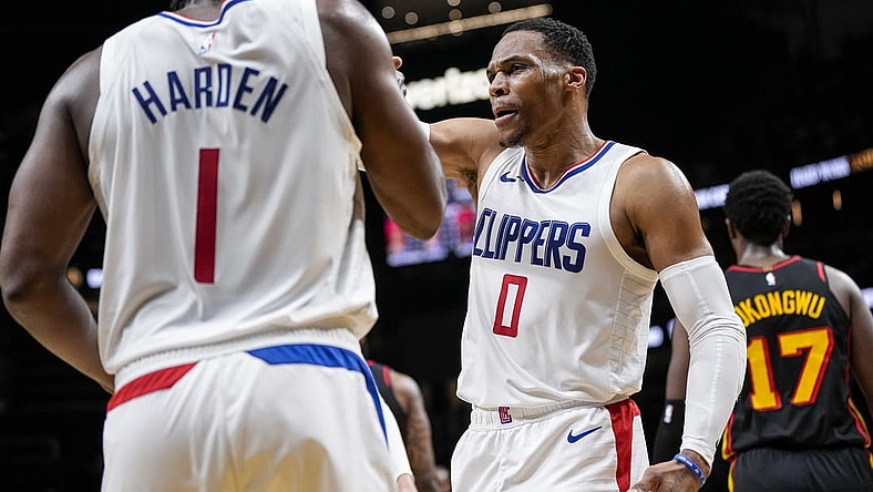 Feb 5, 2024; Atlanta, Georgia, USA; LA Clippers guard Russell Westbrook (0) reacts with guard James Harden (1) against the Atlanta Hawks during the second half at State Farm Arena. Mandatory Credit: Dale Zanine-USA TODAY Sports