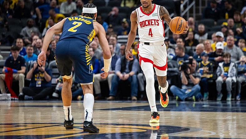 Feb 6, 2024; Indianapolis, Indiana, USA;  Houston Rockets guard Jalen Green (4) dribbles the ball while Indiana Pacers guard Andrew Nembhard (2) defends in the first half at Gainbridge Fieldhouse. Mandatory Credit: Trevor Ruszkowski-USA TODAY Sports
