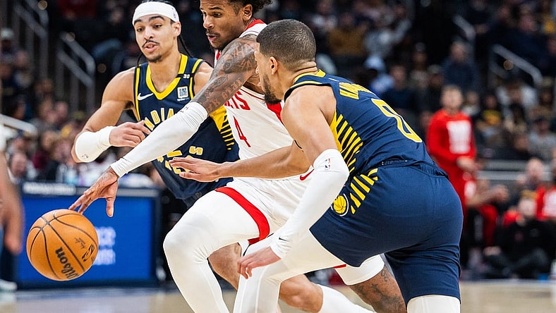 Feb 6, 2024; Indianapolis, Indiana, USA;  Houston Rockets forward Amen Thompson (1) dribbles the ball while Indiana Pacers guard Tyrese Haliburton (0) defends in the first half at Gainbridge Fieldhouse. Mandatory Credit: Trevor Ruszkowski-USA TODAY Sports