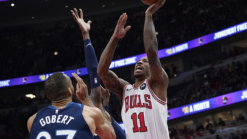 Feb 6, 2024; Chicago, Illinois, USA; Minnesota Timberwolves center Rudy Gobert (27) defends Chicago Bulls forward DeMar DeRozan (11) during the first quarter at United Center. Mandatory Credit: David Banks-USA TODAY Sports