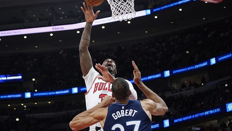 Feb 6, 2024; Chicago, Illinois, USA; Chicago Bulls center Andre Drummond (3) shoots over Minnesota Timberwolves center Rudy Gobert (27) during the first quarter at United Center. Mandatory Credit: David Banks-USA TODAY Sports