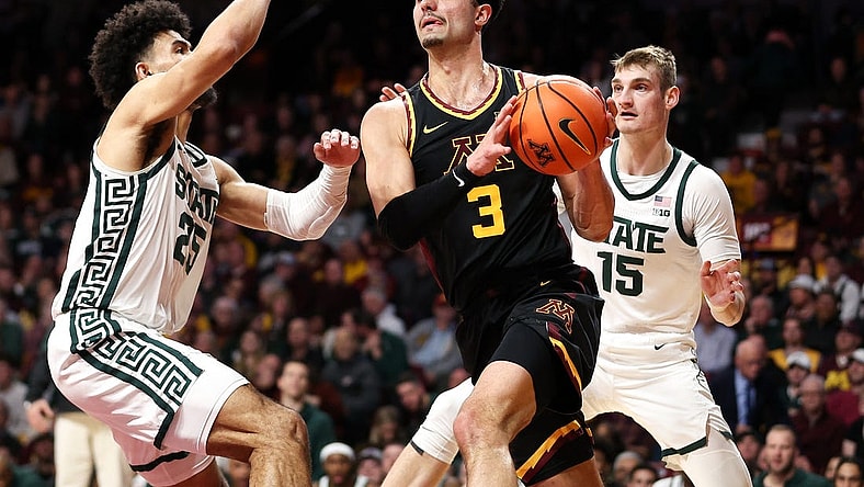 Feb 6, 2024; Minneapolis, Minnesota, USA; Minnesota Golden Gophers forward Dawson Garcia (3) works around Michigan State Spartans forward Malik Hall (25) and center Carson Cooper (15) during the first half at Williams Arena. Mandatory Credit: Matt Krohn-USA TODAY Sports