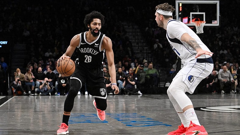 Feb 6, 2024; Brooklyn, New York, USA; Brooklyn Nets guard Spencer Dinwiddie (26) makes a move against Dallas Mavericks guard Luka Doncic (77) during the fourth quarter at Barclays Center. Mandatory Credit: John Jones-USA TODAY Sports