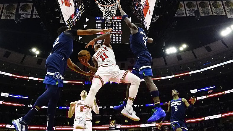 Feb 6, 2024; Chicago, Illinois, USA; Chicago Bulls forward DeMar DeRozan (11) is defended by Minnesota Timberwolves guard Anthony Edwards (5) during the second half at United Center. Mandatory Credit: David Banks-USA TODAY Sports