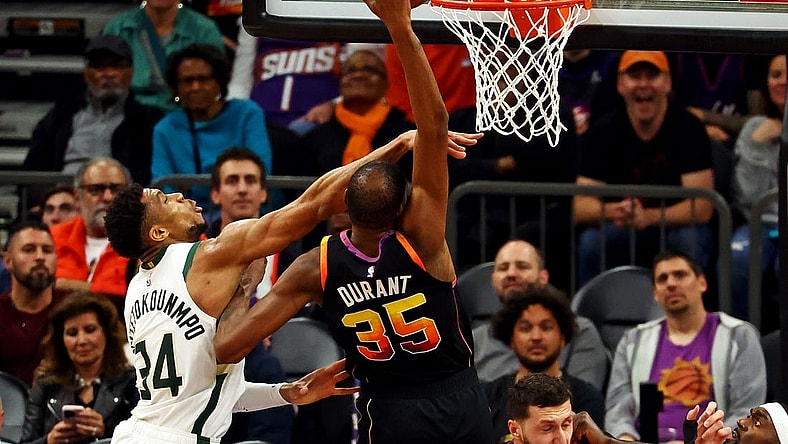 Feb 6, 2024; Phoenix, Arizona, USA; Phoenix Suns forward Kevin Durant (35) shoots the ball against Milwaukee Bucks forward Giannis Antetokounmpo (34) during the fourth quarter at Footprint Center. Mandatory Credit: Mark J. Rebilas-USA TODAY Sports