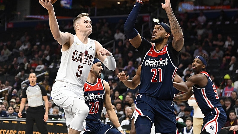 Feb 7, 2024; Washington, District of Columbia, USA; Cleveland Cavaliers guard Sam Merrill (5) prepares to shoot over Washington Wizards center Daniel Gafford (21) during the first half at Capital One Arena. Mandatory Credit: Brad Mills-USA TODAY Sports