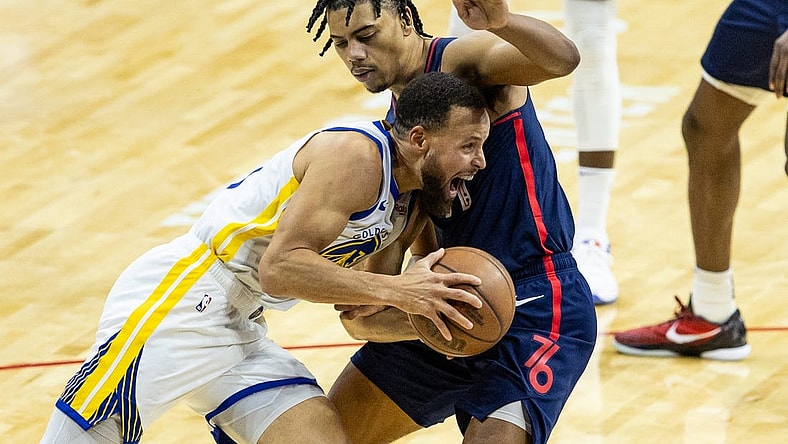 Feb 7, 2024; Philadelphia, Pennsylvania, USA; Golden State Warriors guard Stephen Curry (30) drives against Philadelphia 76ers guard Jaden Springer (11) during the second quarter at Wells Fargo Center. Mandatory Credit: Bill Streicher-USA TODAY Sports