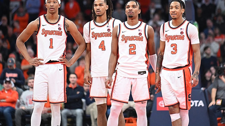 Feb 7, 2024; Syracuse, New York, USA; Syracuse Orange forward Maliq Brown (1) and forward Chris Bell (4) and guard JJ Starling (2) and guard Judah Mintz (3) watch a free throw down court in the second half against the Louisville Cardinals at the JMA Wireless Dome. Mandatory Credit: Mark Konezny-USA TODAY Sports