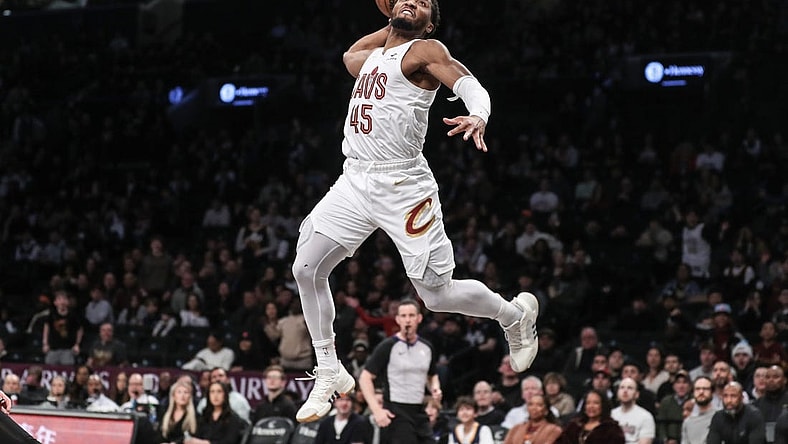 Feb 8, 2024; Brooklyn, New York, USA; Cleveland Cavaliers guard Donovan Mitchell (45) goes up for a dunk in the first quarter against the Brooklyn Nets at Barclays Center. Mandatory Credit: Wendell Cruz-USA TODAY Sports