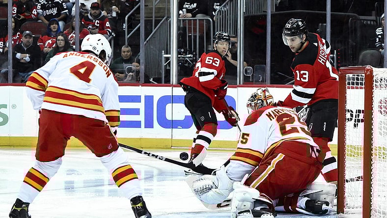 Feb 8, 2024; Newark, New Jersey, USA; Calgary Flames goaltender Jacob Markstrom (25) makes a save against the New Jersey Devils during the second period at Prudential Center. Mandatory Credit: John Jones-USA TODAY Sports