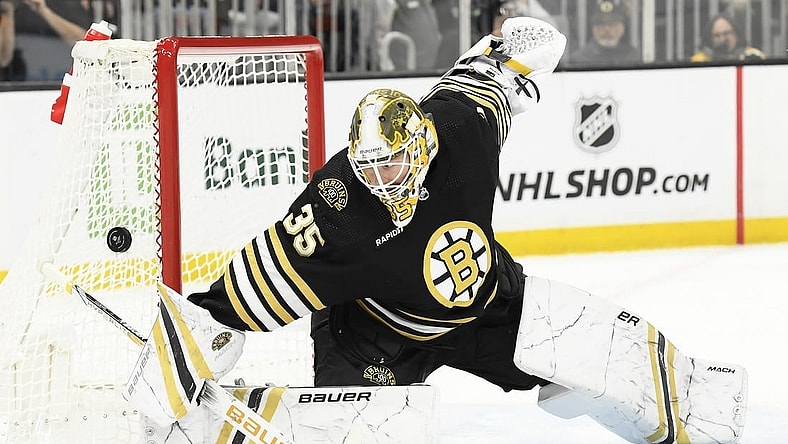 Feb 8, 2024; Boston, Massachusetts, USA; Boston Bruins goaltender Linus Ullmark (35) makes a save during the second period against the Vancouver Canucks at TD Garden. Mandatory Credit: Bob DeChiara-USA TODAY Sports