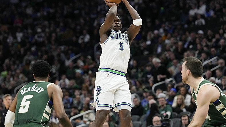 Feb 8, 2024; Milwaukee, Wisconsin, USA;  Minnesota Timberwolves guard Anthony Edwards (5) shoots during the second quarter against the Milwaukee Bucks at Fiserv Forum. Mandatory Credit: Jeff Hanisch-USA TODAY Sports