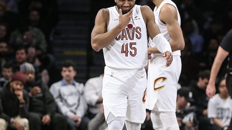 Feb 8, 2024; Brooklyn, New York, USA; Cleveland Cavaliers guard Donovan Mitchell (45) reacts after getting hit in the face in the fourth quarter against the Brooklyn Nets at Barclays Center. Mandatory Credit: Wendell Cruz-USA TODAY Sports