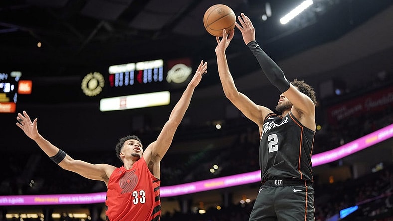 Feb 8, 2024; Portland, Oregon, USA; Detroit Pistons point guard Cade Cunningham (2) shoots the ball over Portland Trail Blazers forward Toumani Camara (33) during the first half at Moda Center. Mandatory Credit: Soobum Im-USA TODAY Sports