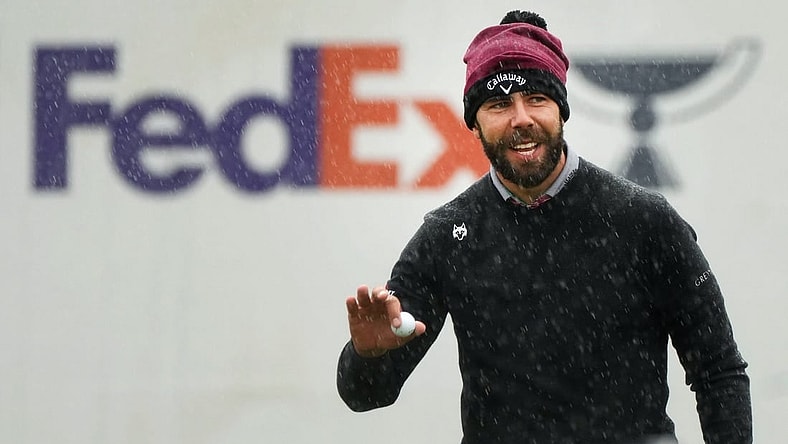 Erik van Rooyen acknowledges the crowd after his birdie putt in the rain on the 16th hole during the 2024 Phoenix Open at TPC Scottsdale on Feb. 8, 2024.