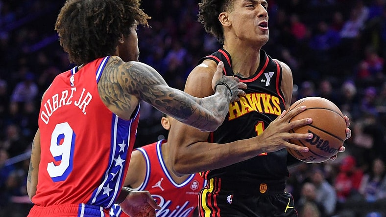 Feb 9, 2024; Philadelphia, Pennsylvania, USA; Atlanta Hawks forward Jalen Johnson (1) drives past Philadelphia 76ers guard Kelly Oubre Jr. (9) during the first quarter at Wells Fargo Center. Mandatory Credit: Eric Hartline-USA TODAY Sports