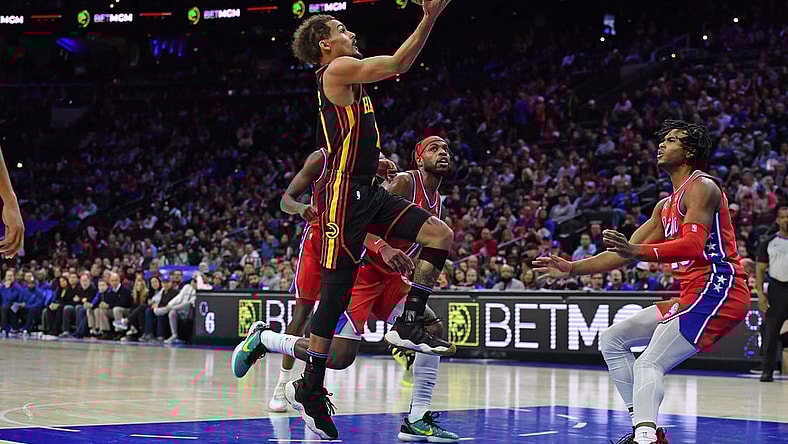 Feb 9, 2024; Philadelphia, Pennsylvania, USA; Atlanta Hawks guard Trae Young (11) drives to the basket past Philadelphia 76ers guard Buddy Hield (17) during the second quarter at Wells Fargo Center. Mandatory Credit: Eric Hartline-USA TODAY Sports