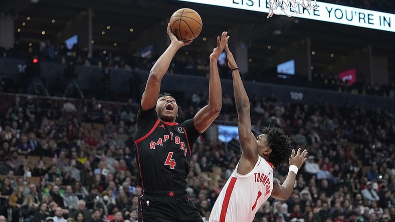 Feb 9, 2024; Toronto, Ontario, CAN; Toronto Raptors forward Scottie Barnes (4) shoots for a basket against Houston Rockets forward Amen Thompson (1) during the first half at Scotiabank Arena. Mandatory Credit: John E. Sokolowski-USA TODAY Sports