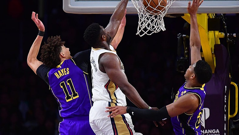 Feb 9, 2024; Los Angeles, California, USA; New Orleans Pelicans forward Zion Williamson (1) dunks for the basket against Los Angeles Lakers forward Rui Hachimura (28) and center Jaxson Hayes (11) during the first half at Crypto.com Arena. Mandatory Credit: Gary A. Vasquez-USA TODAY Sports