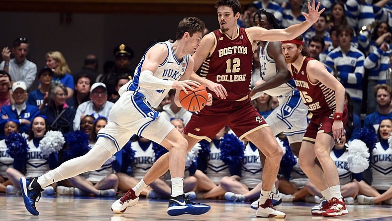 Feb 10, 2024; Durham, North Carolina, USA; Duke Blue Devils center Kyle Filipowski (30) drives to the basket against Boston College Eagles center Quinten Post (12) during the first half  at Cameron Indoor Stadium. Mandatory Credit: Rob Kinnan-USA TODAY Sports